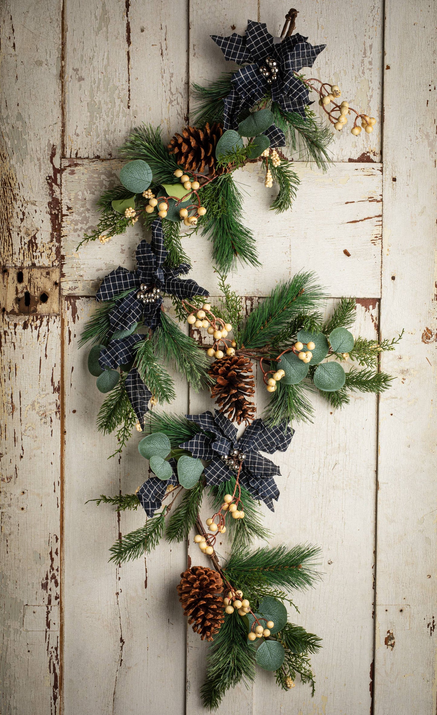 Cross Check Pointsettia Garland With Pine Cones